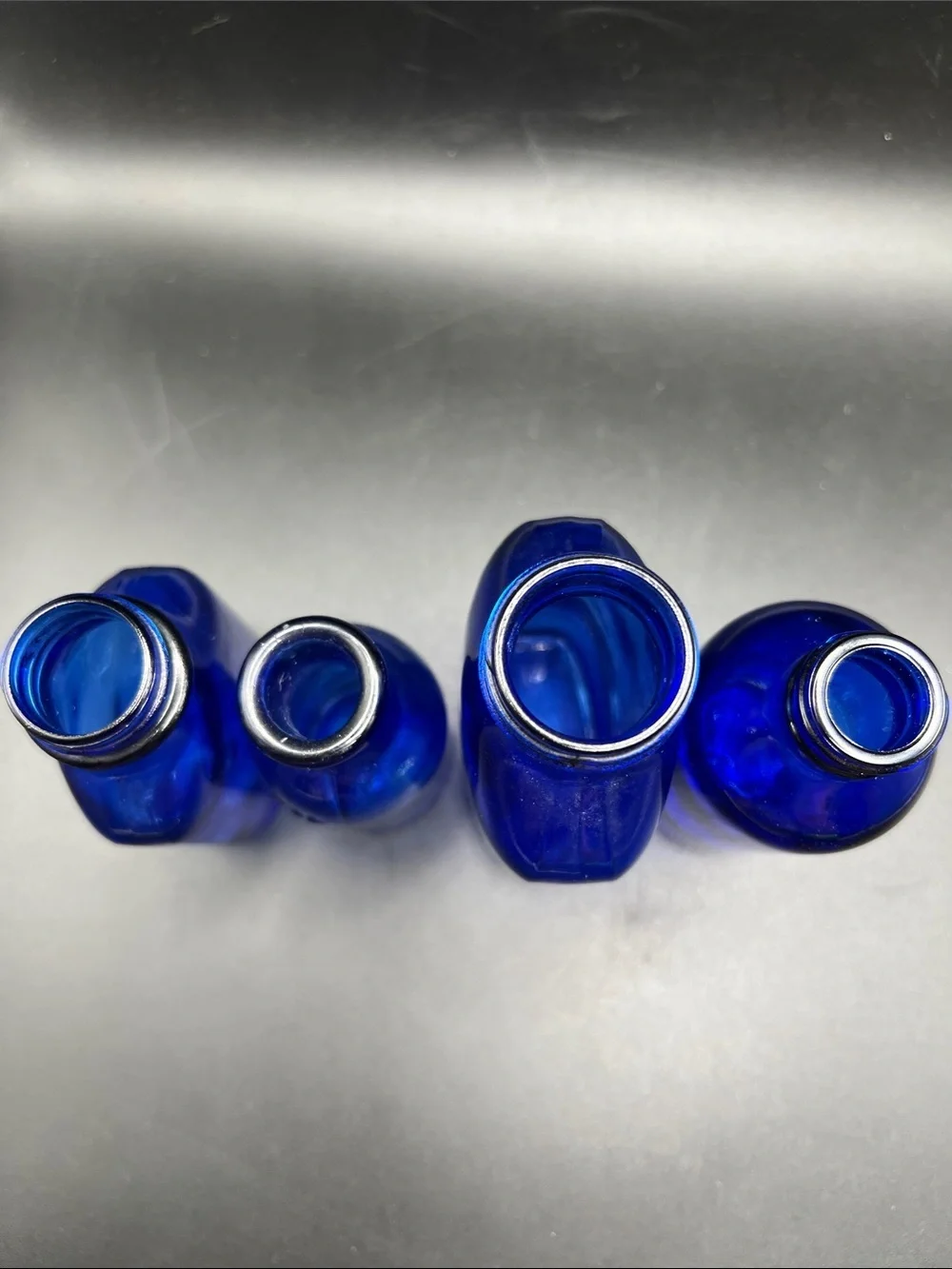 Lot of 4 vintage Colbalt Blue Glass Bottles